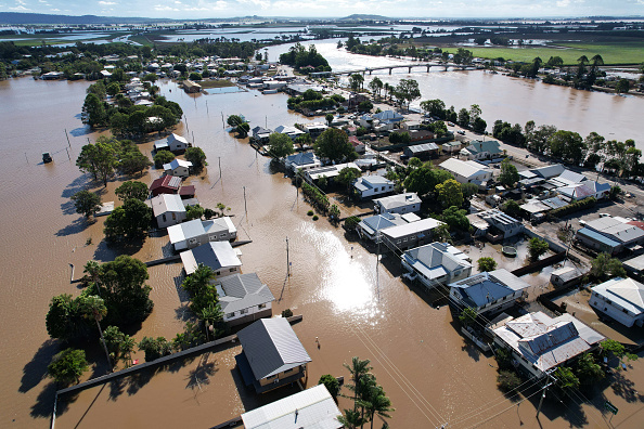 WOODBURN, AUSTRALIA - MARCH 07: An aerial drone view of houses inundated by floodwater on March 07, 2022 in Woodburn, Australia. Residents of northern New South Wales are still cleaning up following unprecedented storms and the worst flooding in a decade.