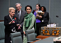 Aung San Suu Kyi with the Speaker and Clerk in the House of Representatives chamber