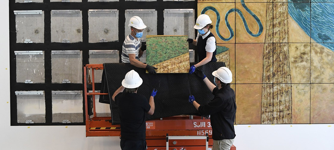 Parliament House Art Collection staff doing conservation works on the great hall murals