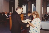 40th anniversary of first Australian citizenship ceremony held at Parliament House, Canberra. Award is presented to the recipient by Governor General, Sir Ninian Stephen, 1989