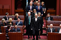 Serjeant-at-Arms leading members into the Senate chamber