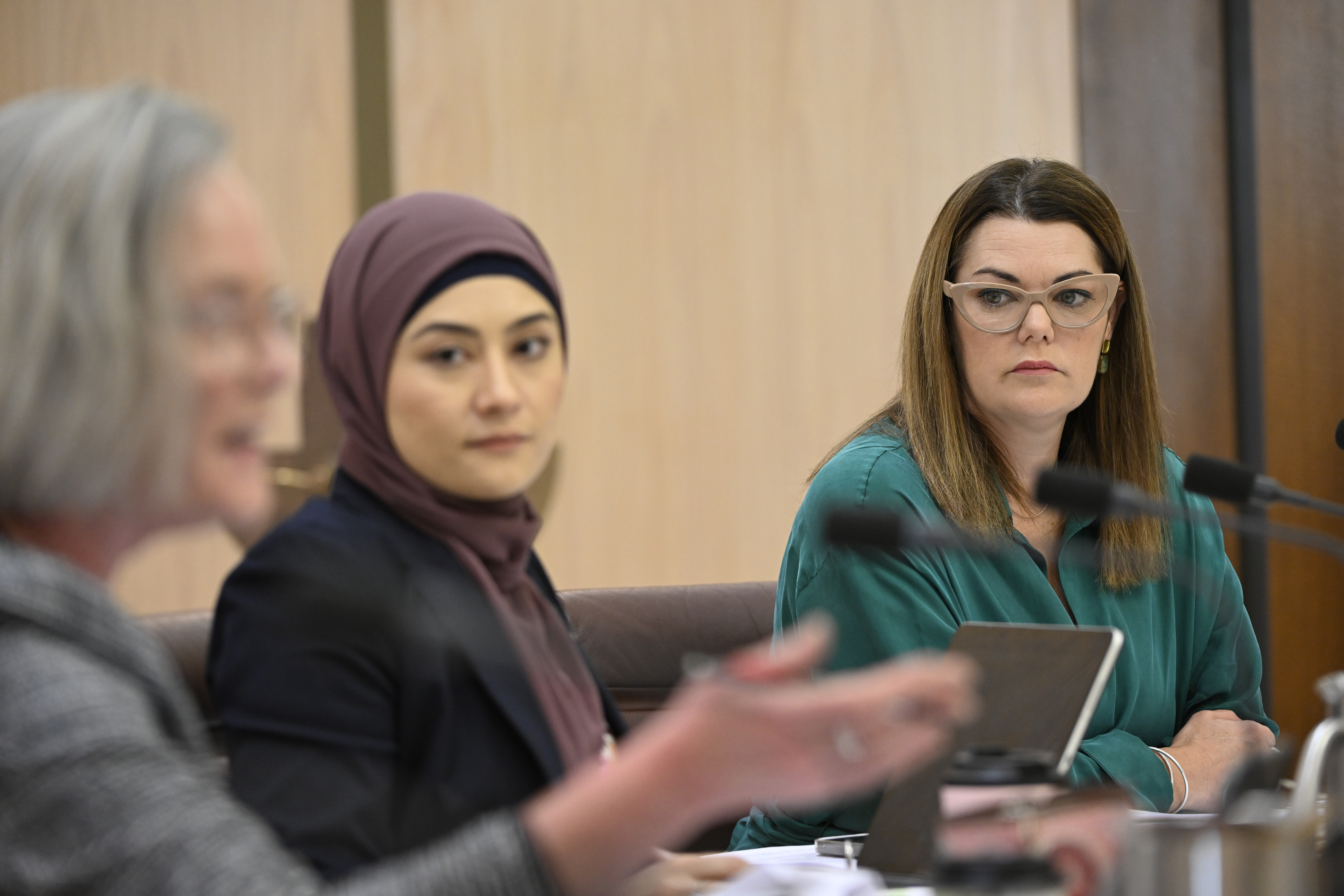 Senators Hanson-Young, Payman and Grogan sitting at a table in a public hearing