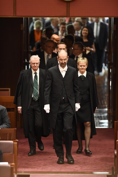 Serjeant-at-Arms leading members into the Senate