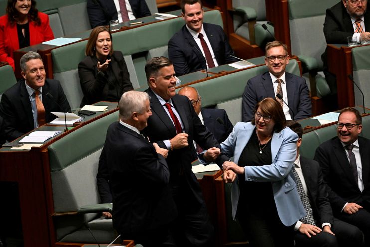 Hon Milton Dick MP being led to the Speaker's Chair