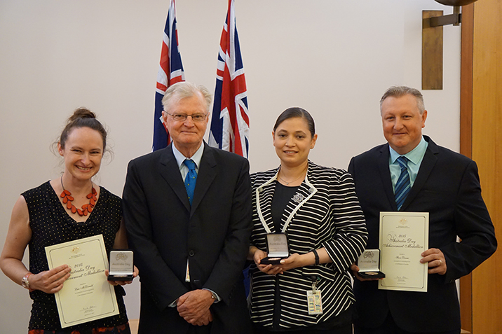 The Clerk of the House, David Elder, with the recipients of the 2015 Australia Day Achievement Medallions.