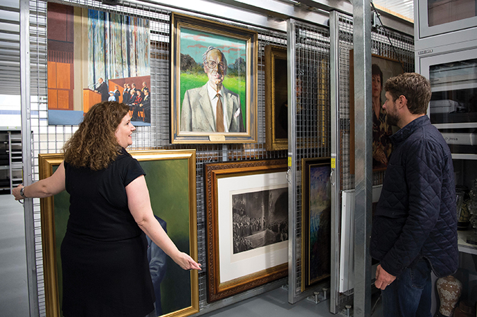 Director, Art Collection and Exhibitions, Justine van Mourik with artist Ben Quilty view works from the collections.