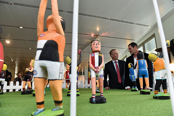 The Speaker of the House of Representatives, the Hon Tony Smith MP with Mr Marc Gooch, representing artist Dinny Kunoth Kemarre at the launch of The AFL Dream Team, a new acquisition for the collections.