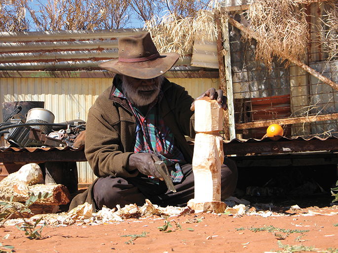 Dinny Kunoth Kemarre carved his football dream team from the wood of the bean tree.
