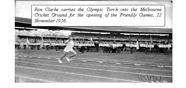 Ron Clark carries the Olympic Torch into the Melbourne Cricket Ground