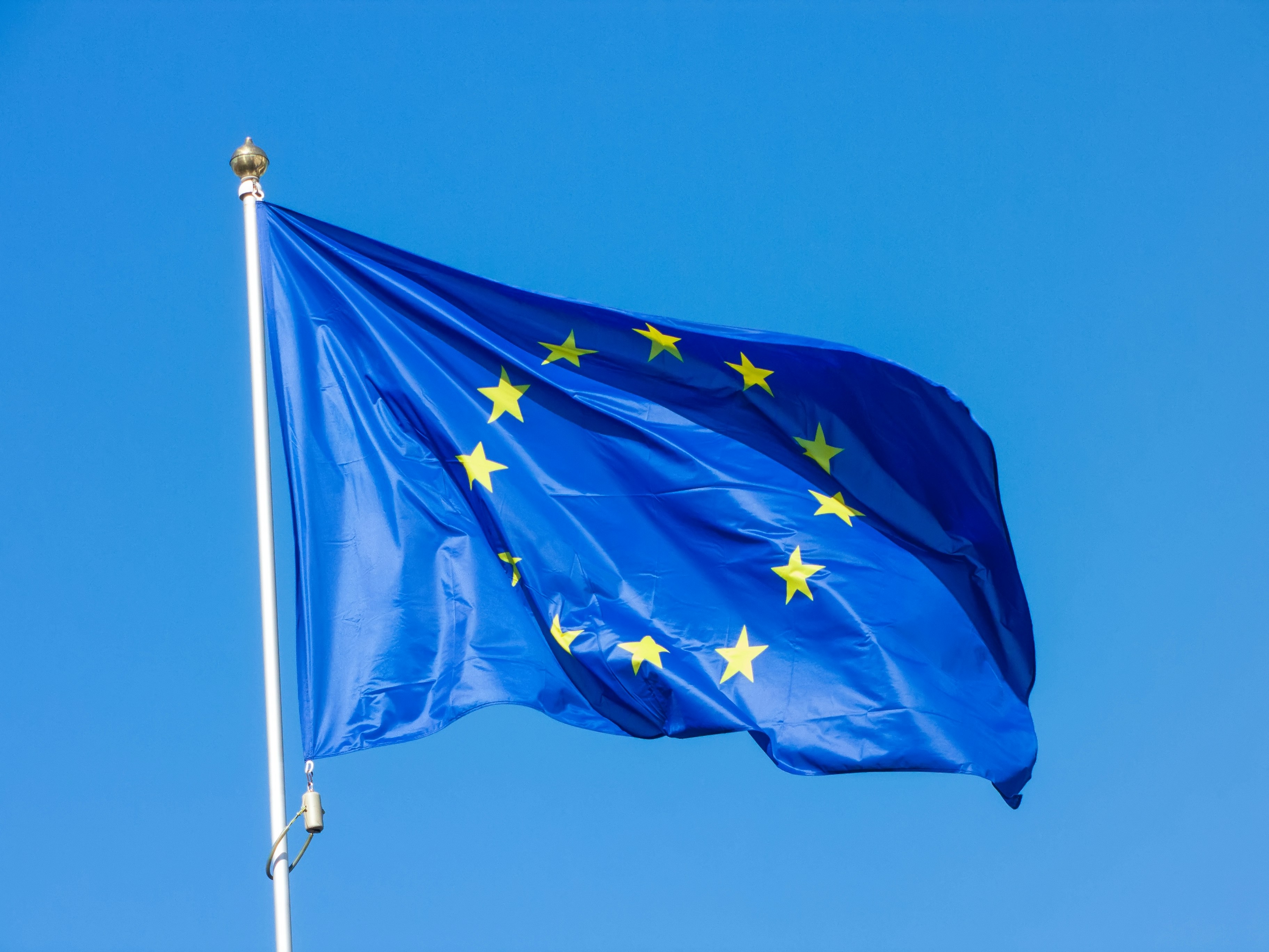 Image of the EU Flag against a blue sky