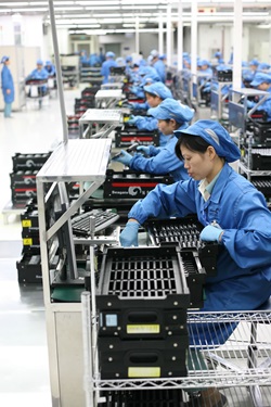 Workers perform final testing and QA before sending drives off to customers on its 2.5-inch notebook lines.