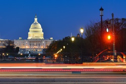 Washington DC at night - US Capitol Building with car lights trails foreground