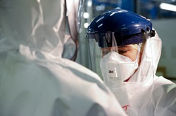 People wearing personal protective equipment