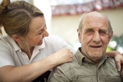 Elderly man with carer
