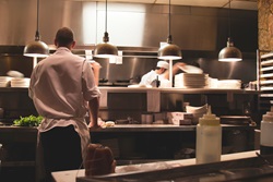 Chef doing meal preparation in a kitchen