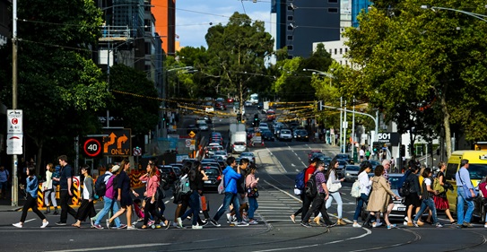 Photo of crowd crossing the street