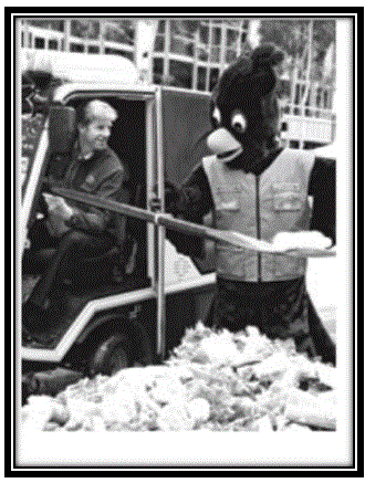 Figure 7: Games mascot Karak assisting in pre Games clean-up tasks