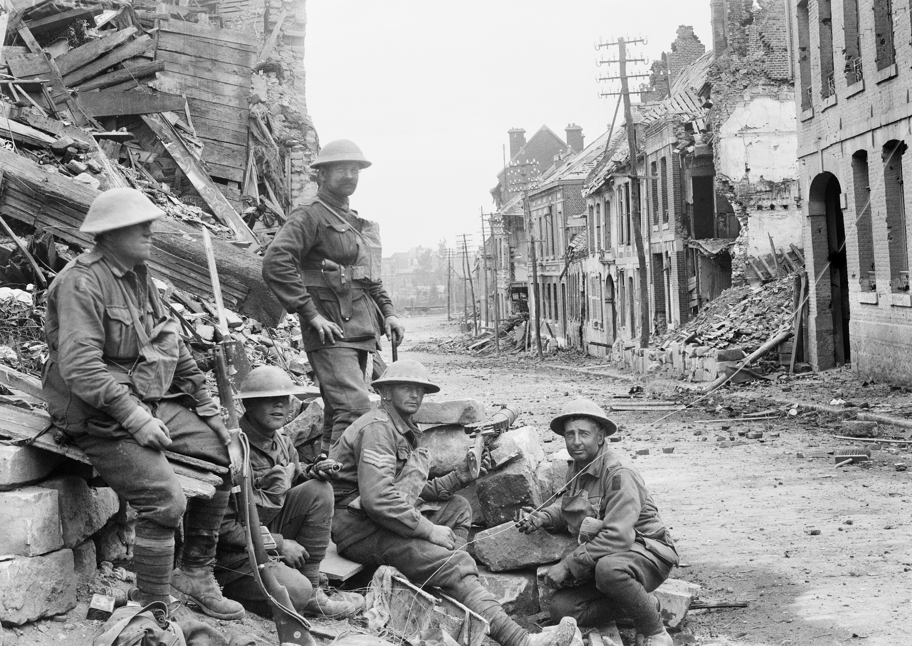 Members of the 54th Infantry Battalion in Peronne, the day after the battle, 2 October 1918; image courtesy of the Australian War Memorial.