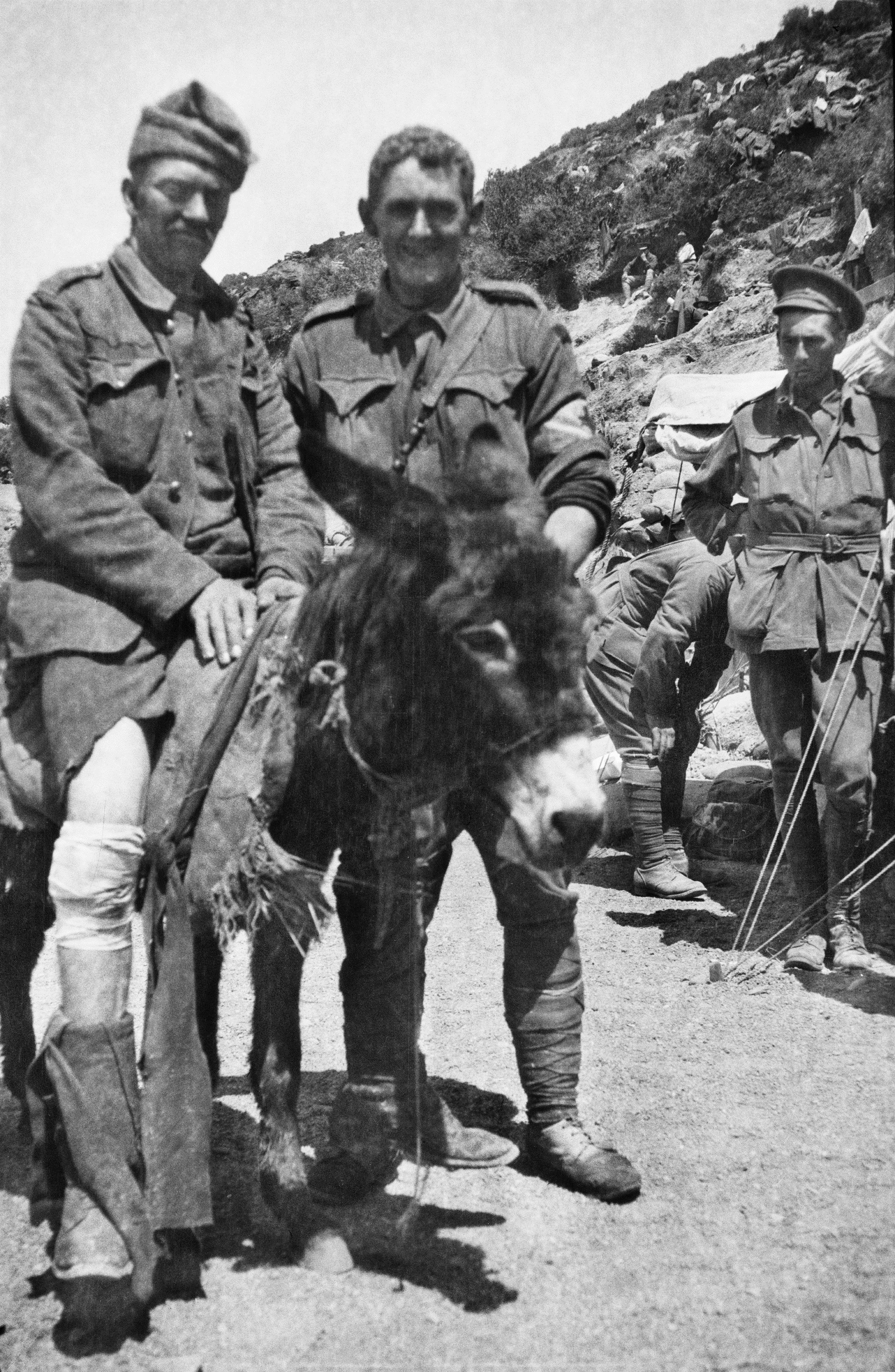 Figure 5: Private John Simpson Kirkpatrick assisting an unidentified soldier, Gallipoli, circa May 1915. Image courtesy of the Australian War Memorial.
