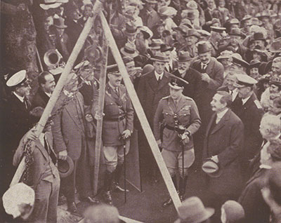 His Majesty The Prince of Wales holding the mallet as the foundation stone is lowered in place, Capitol Hill, Canberra, 1920. Reproduced in A Century of Journalism: The Sydney Morning Herald & Its Record of Australian Life 1831-1931, John Fairfax & Sons Ltd, Sydney, 1931 p. 418.