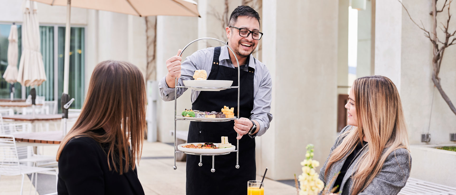 Visitors enjoy high tea on the Signature Experience tour