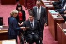 Senators Anning, Bartlett and Steele-John are escorted to the Senate table to take their oaths of office.