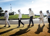 Bee keepers on their way to the first harvest of Parliament House honey.