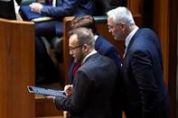 Members use an iPad to record a division in the House of Representatives