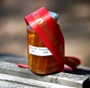 Bottle of Parliament House honey with ribbon