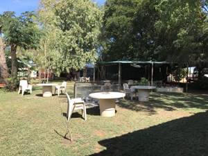 Figure 1.1 & 1.2 (from left to right): View of the central outdoor area, including fire pit; and view of residents' room.
