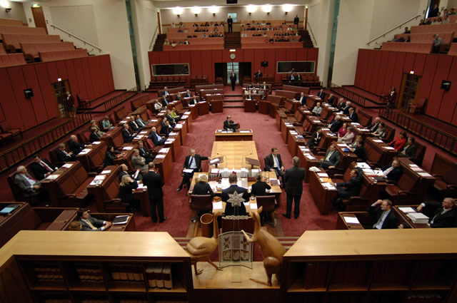 Visitors may sit in the upper galleries on three sides of the chamber